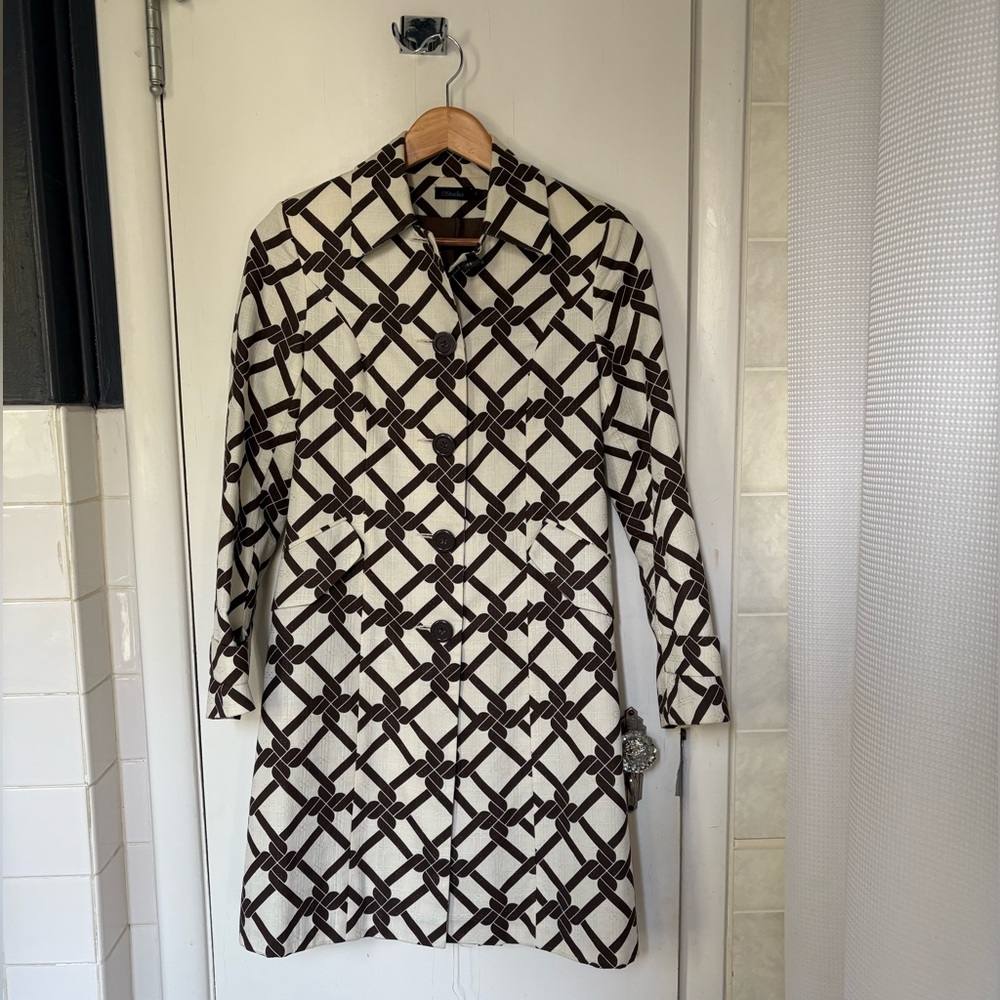 Brown and white cloth trench coat 
Barely worn